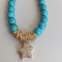 KADIN YILDIZ TAŞLI GOLD DETAYLI ÇELİK TASARIM KOLYE